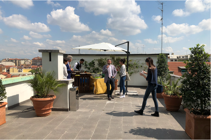 The terrace of the DaSP office in Milan, with the plants and the parasol