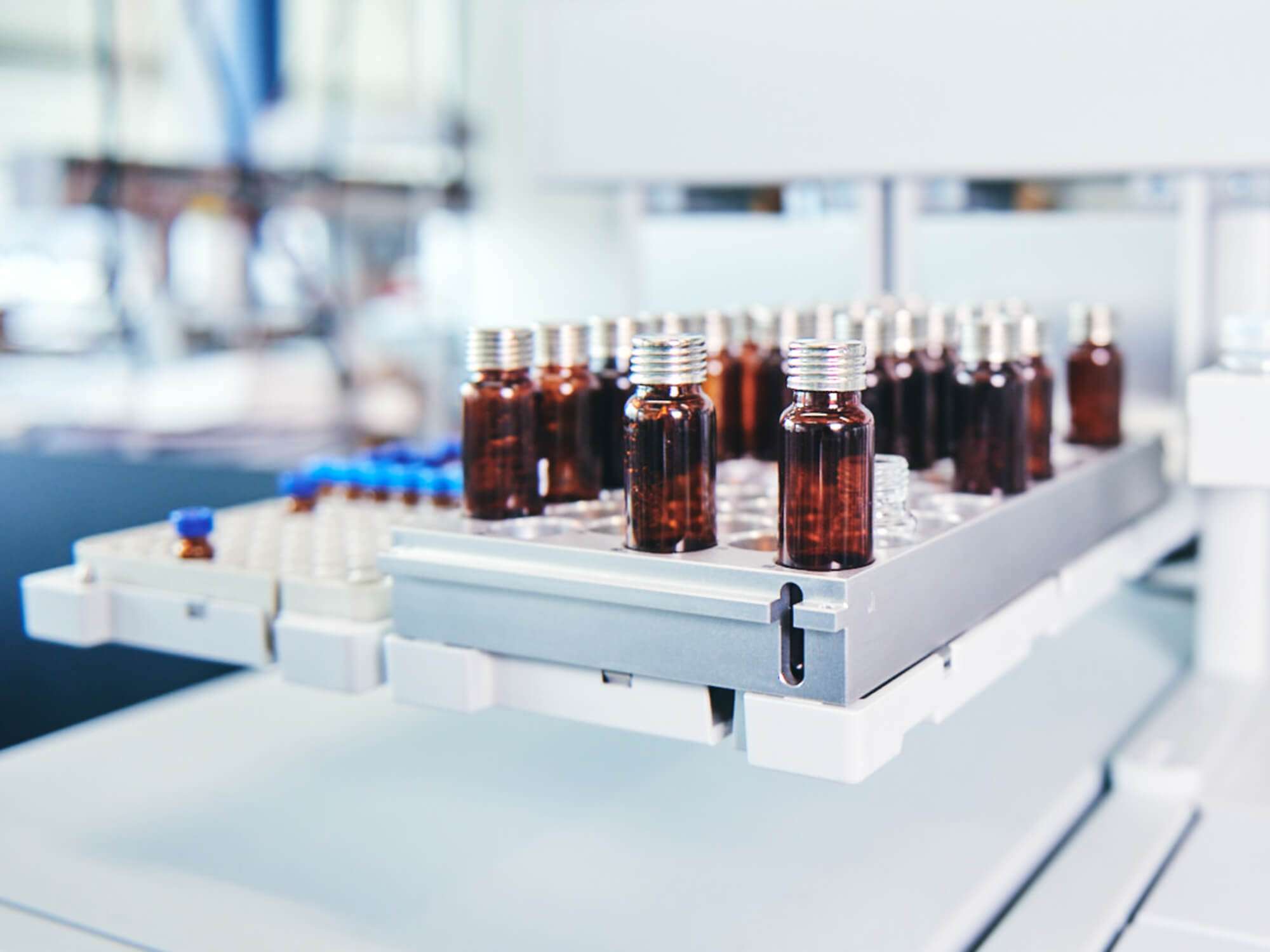 Amber sample vials on the tray, waiting for analysis